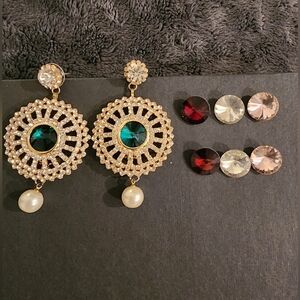 Golden earrings with 4 changeable stones.red green pink and white.